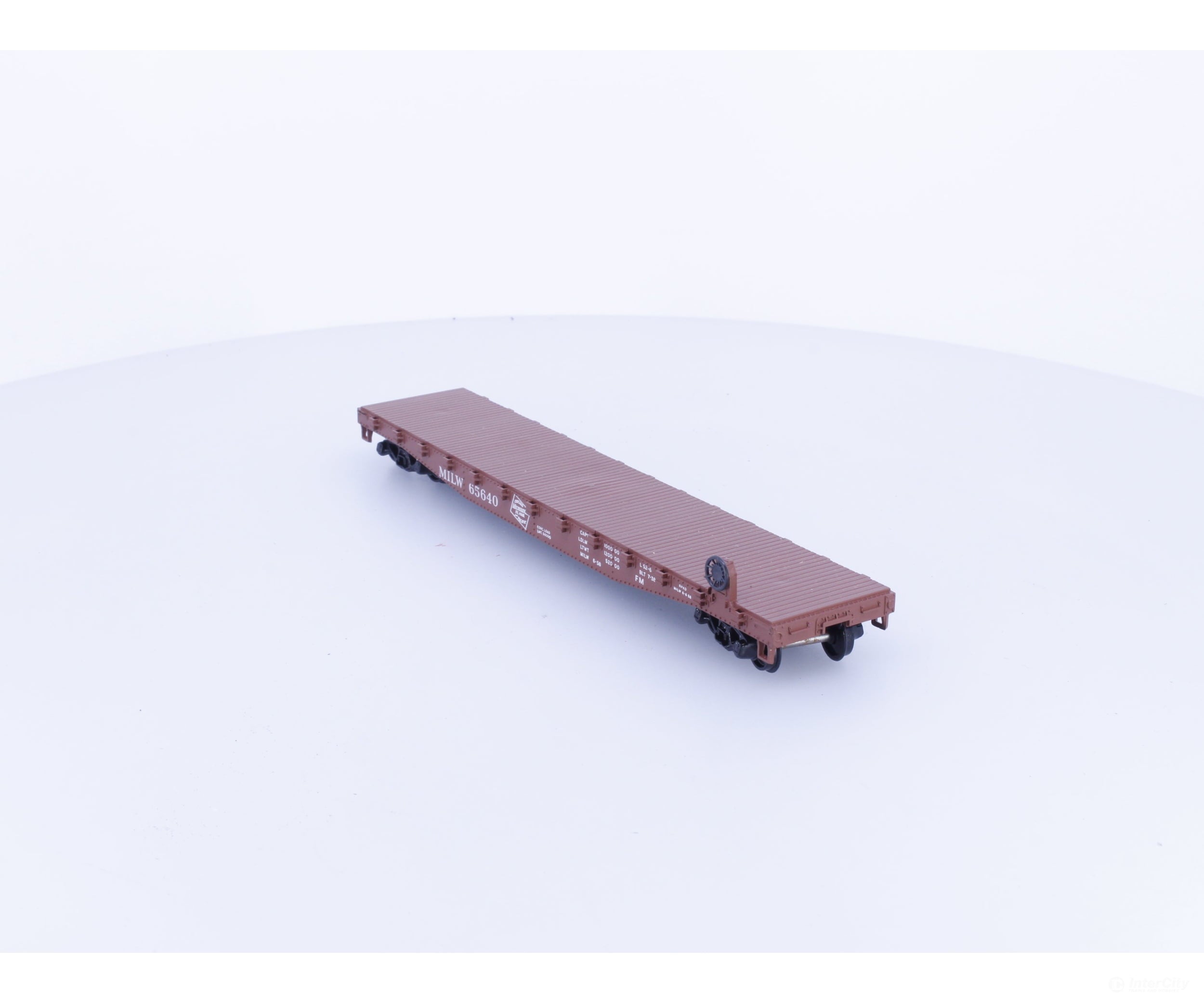 Athearn 1401 HO 50’ Flatcar with Stakes Milwaukee Road (MILW) 65640 - Freight Cars