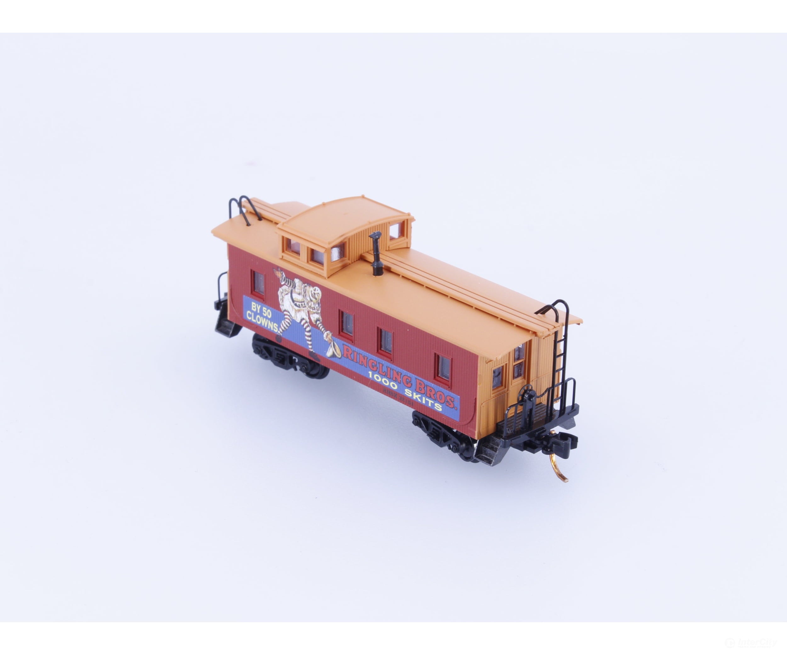 Micro Trains 05100270 N 34’ Wood Sheathed Caboose with Straight Sided Cupola Ringling Bros. and Barnum & Bailey (RBBX)
