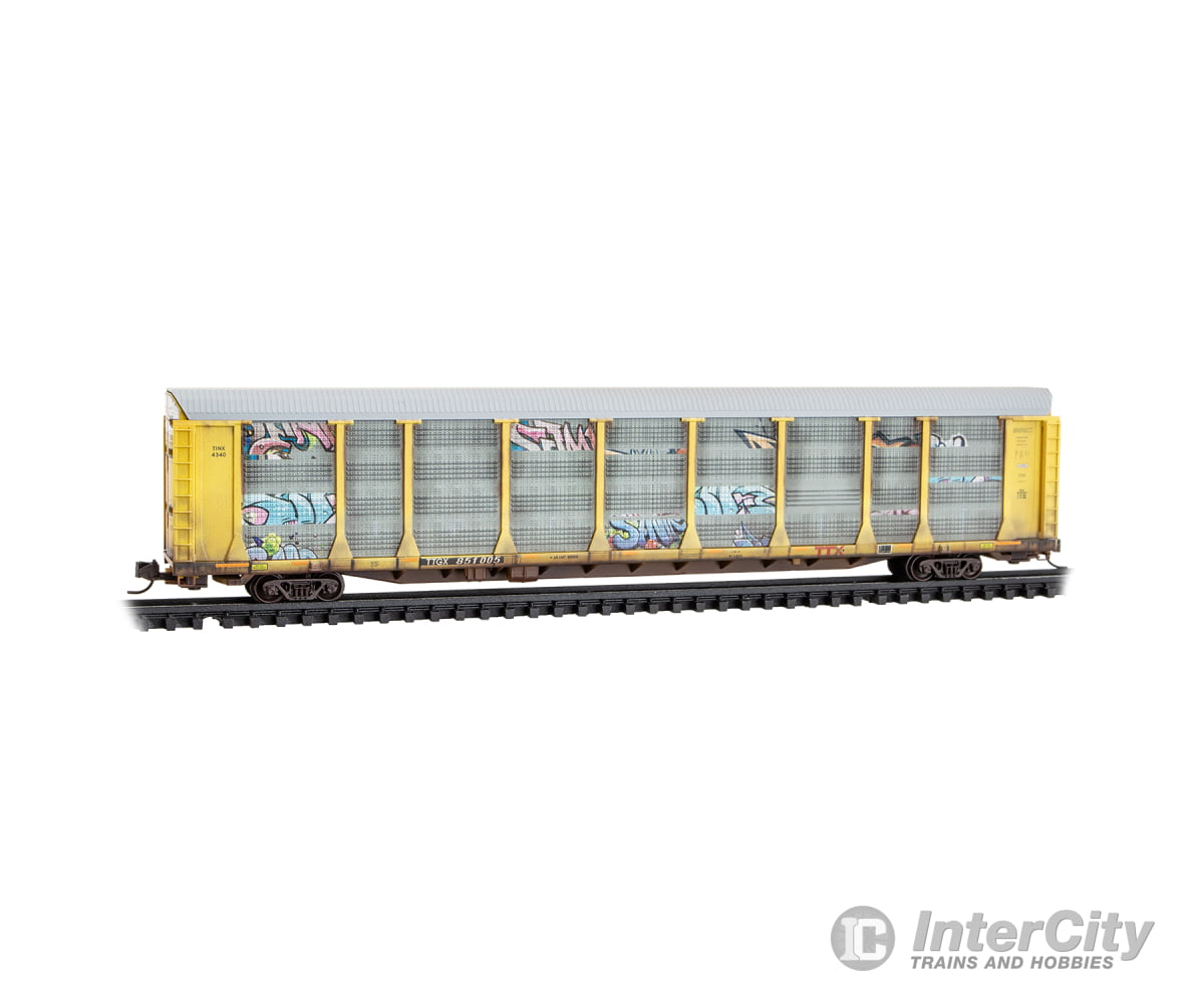 Micro Trains N 11144490 89’ Tri-Level Enclosed Auto Rack - TTX TTGX #851005 (Weathered silver yellow red logo graffiti)