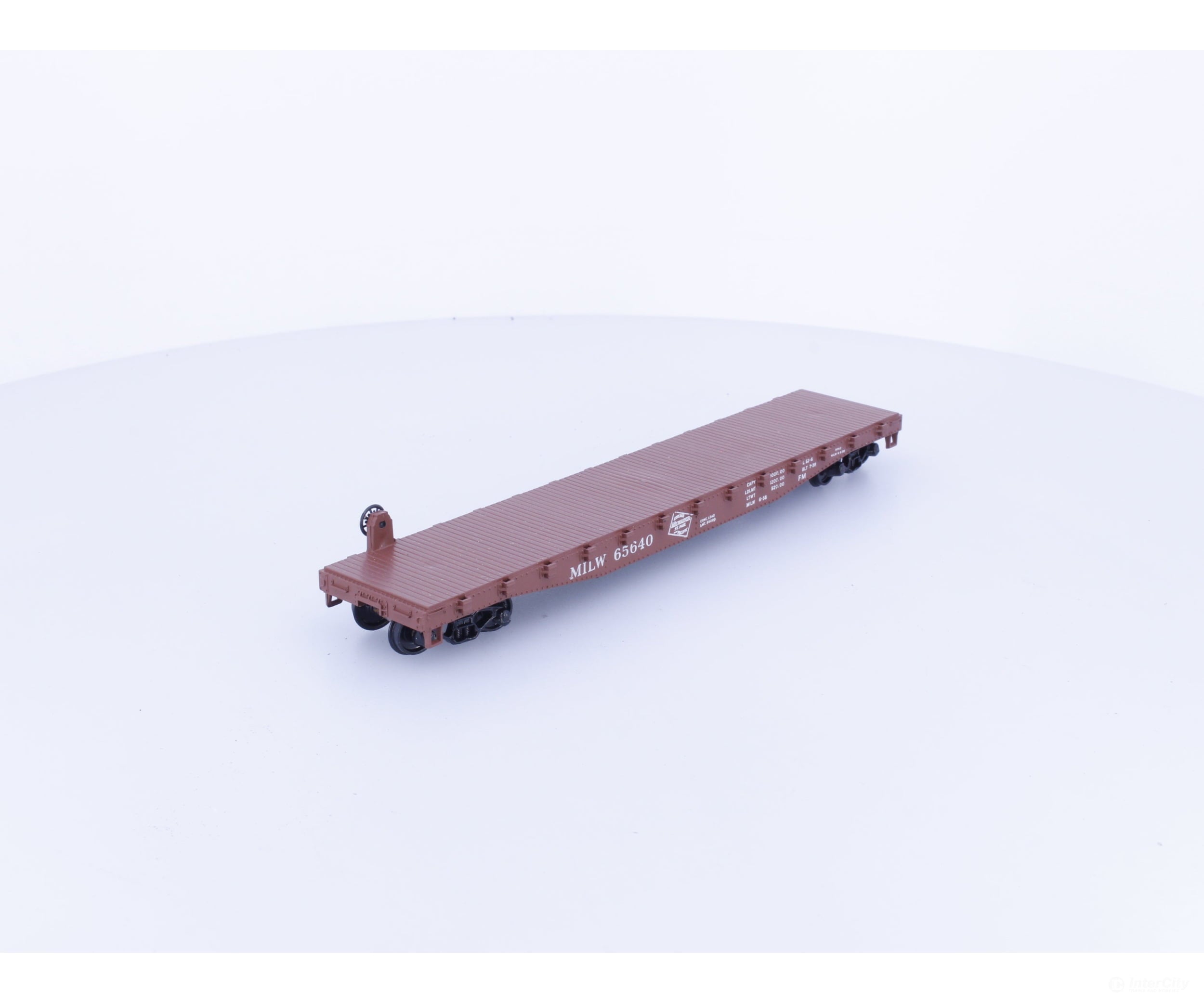 Athearn 1401 HO 50’ Flatcar with Stakes Milwaukee Road (MILW) 65640 - Freight Cars