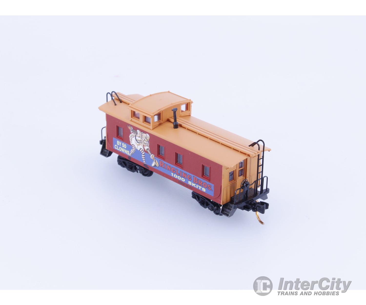 Micro Trains 05100270 N 34’ Wood Sheathed Caboose with Straight Sided Cupola Ringling Bros. and Barnum & Bailey (RBBX)