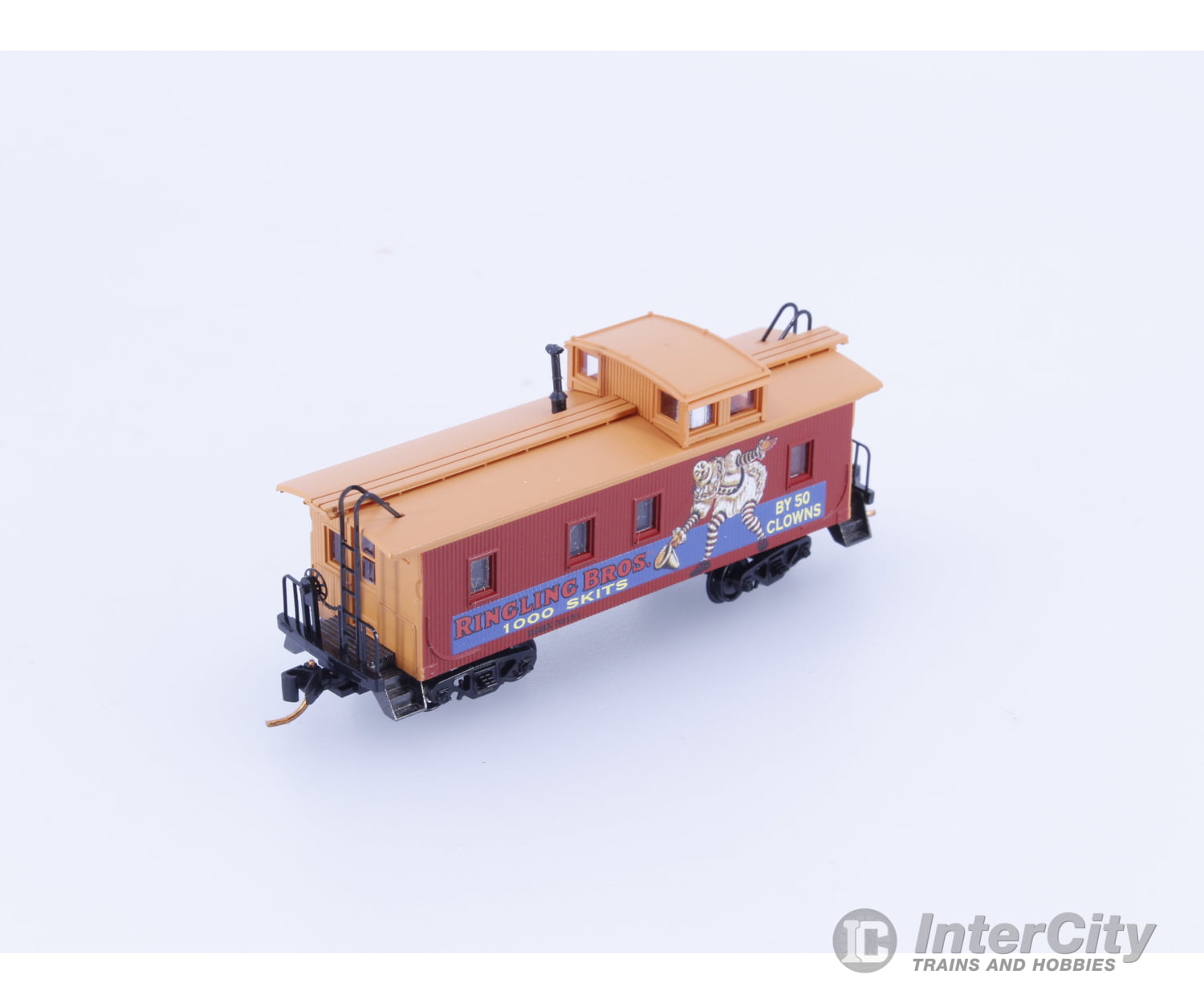Micro Trains 05100270 N 34’ Wood Sheathed Caboose with Straight Sided Cupola Ringling Bros. and Barnum & Bailey (RBBX)