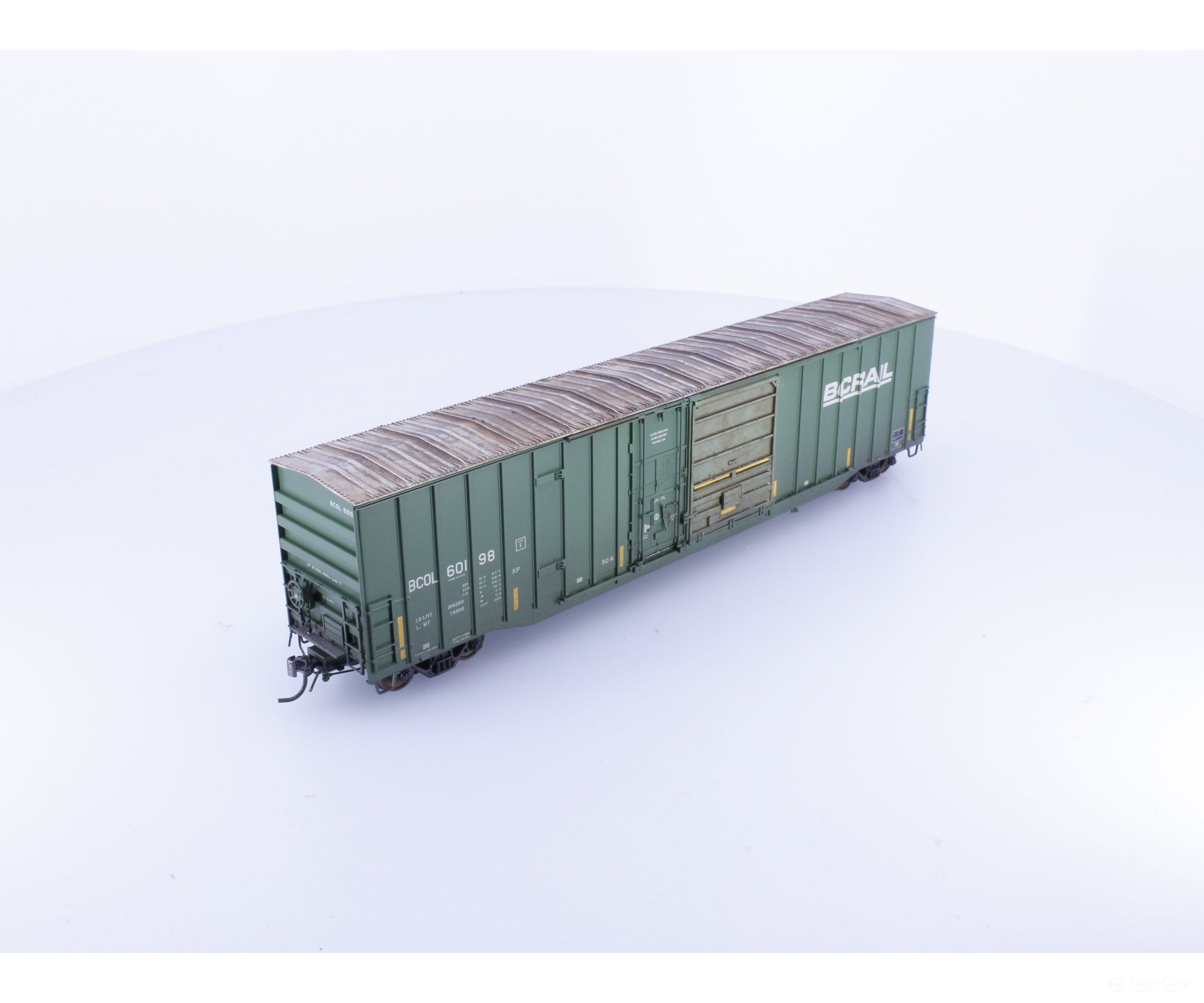 Rapido 191003A-WMT-H HO Trenton Works 6637cuft boxcar: BC Rail - faded w/conspicuity stripes #1 - Weathered by WEATHER