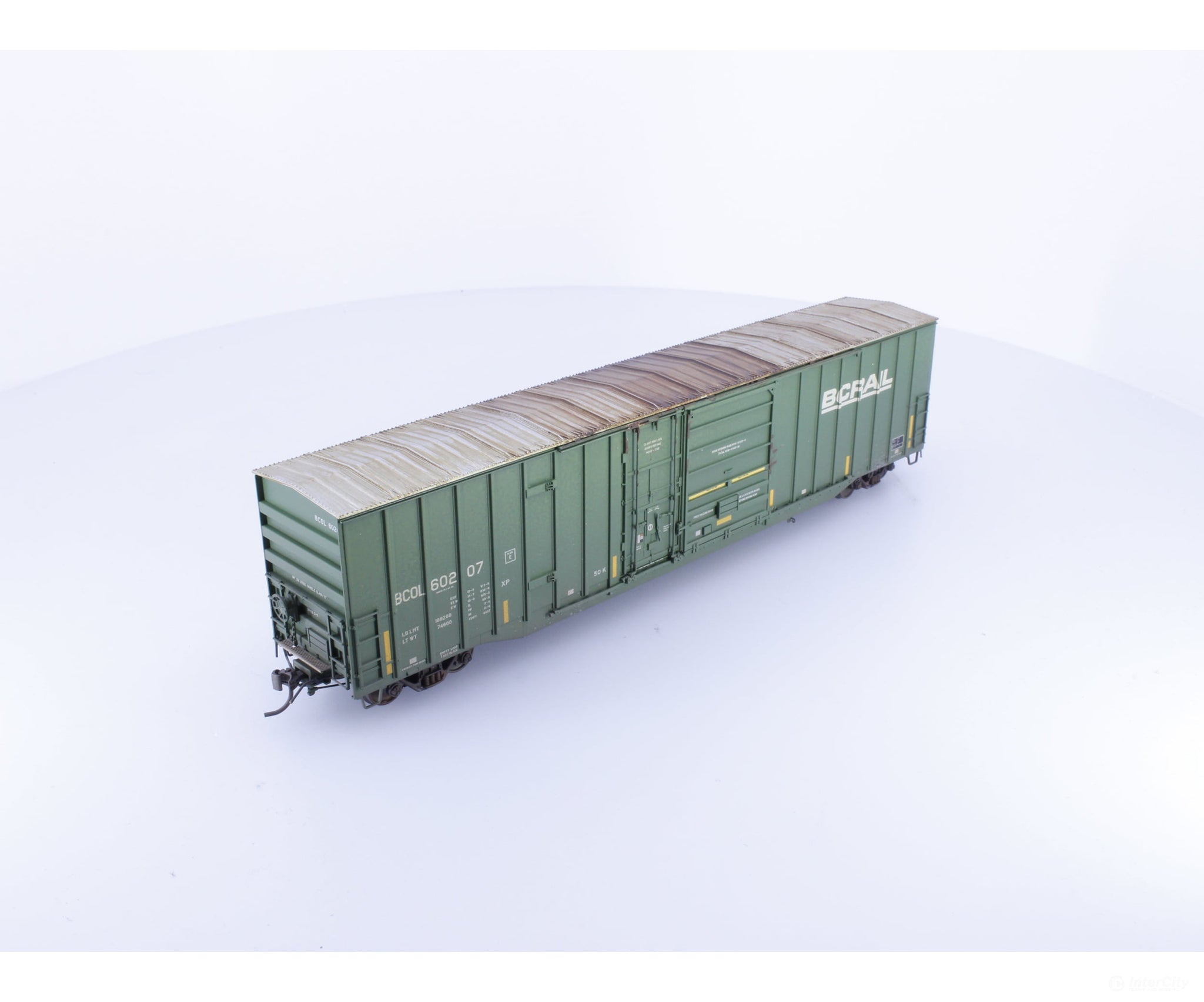 Rapido 191003A-WMT-M HO Trenton Works 6637cuft boxcar: BC Rail - faded w/conspicuity stripes #1 - Weathered by WEATHER