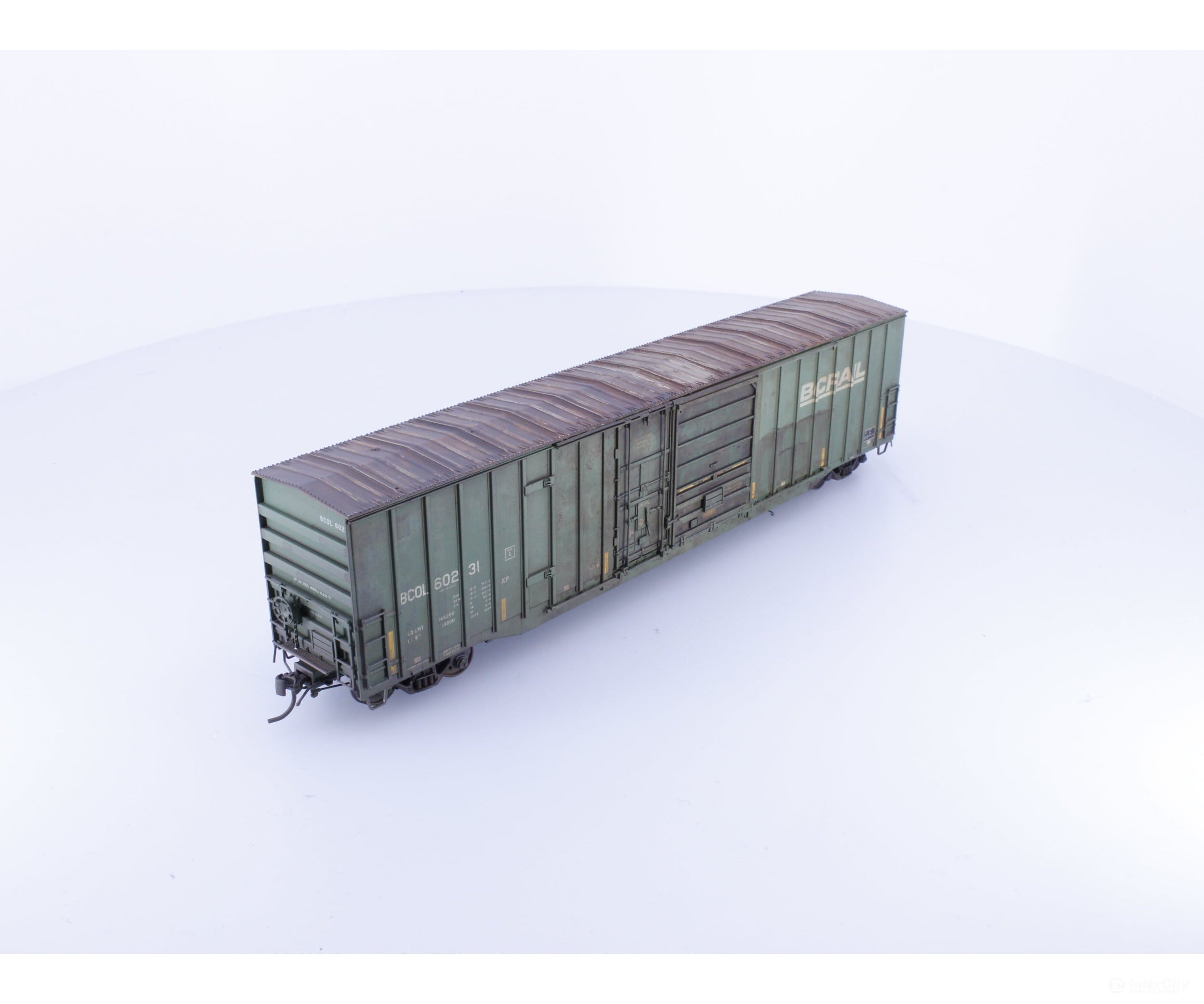 Rapido 191003A-WMT-XH HO Trenton Works 6637cuft boxcar: BC Rail - faded w/conspicuity stripes #1 - Weathered by WEATHER
