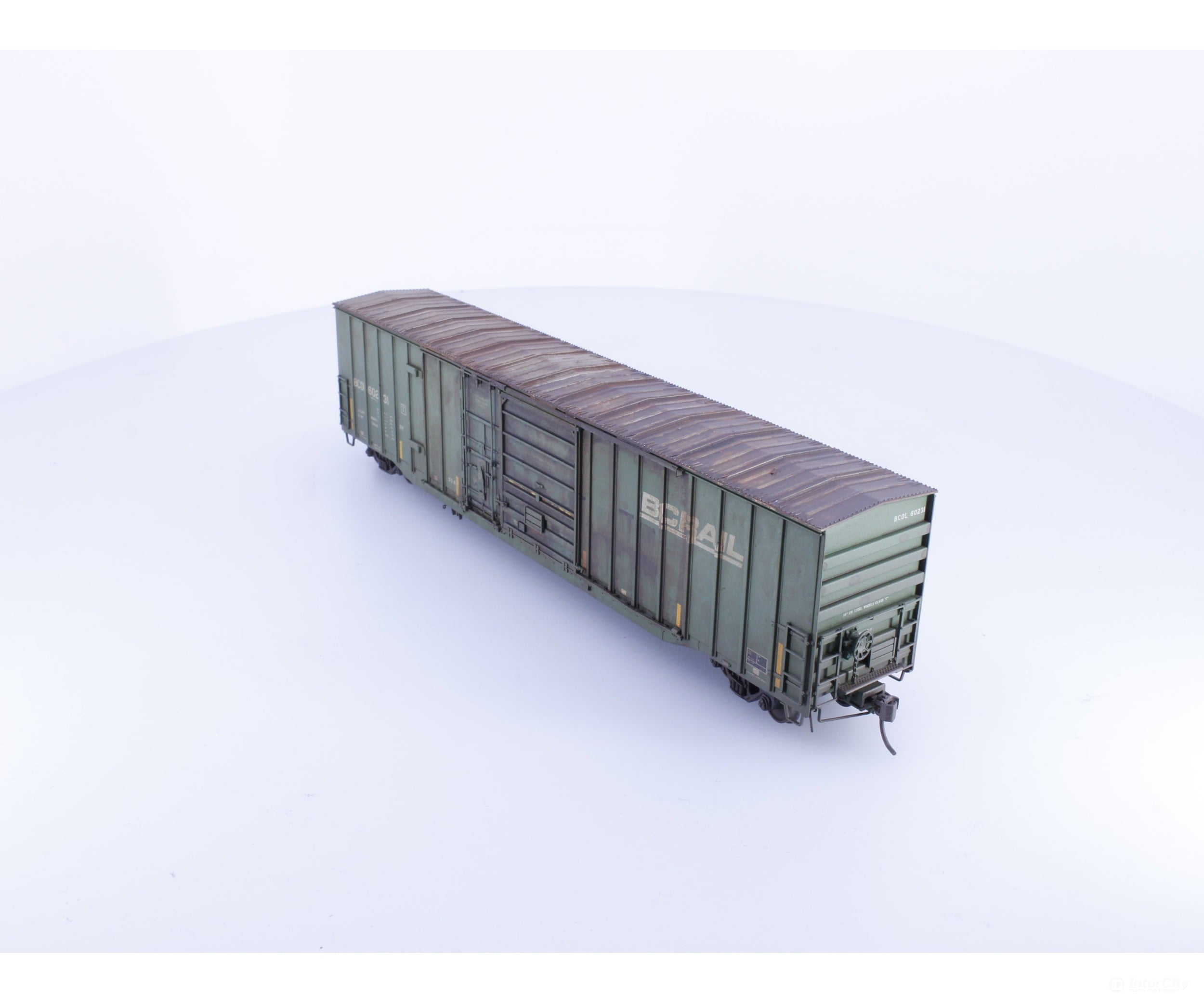 Rapido 191003A-WMT-XH HO Trenton Works 6637cuft boxcar: BC Rail - faded w/conspicuity stripes #1 - Weathered by WEATHER