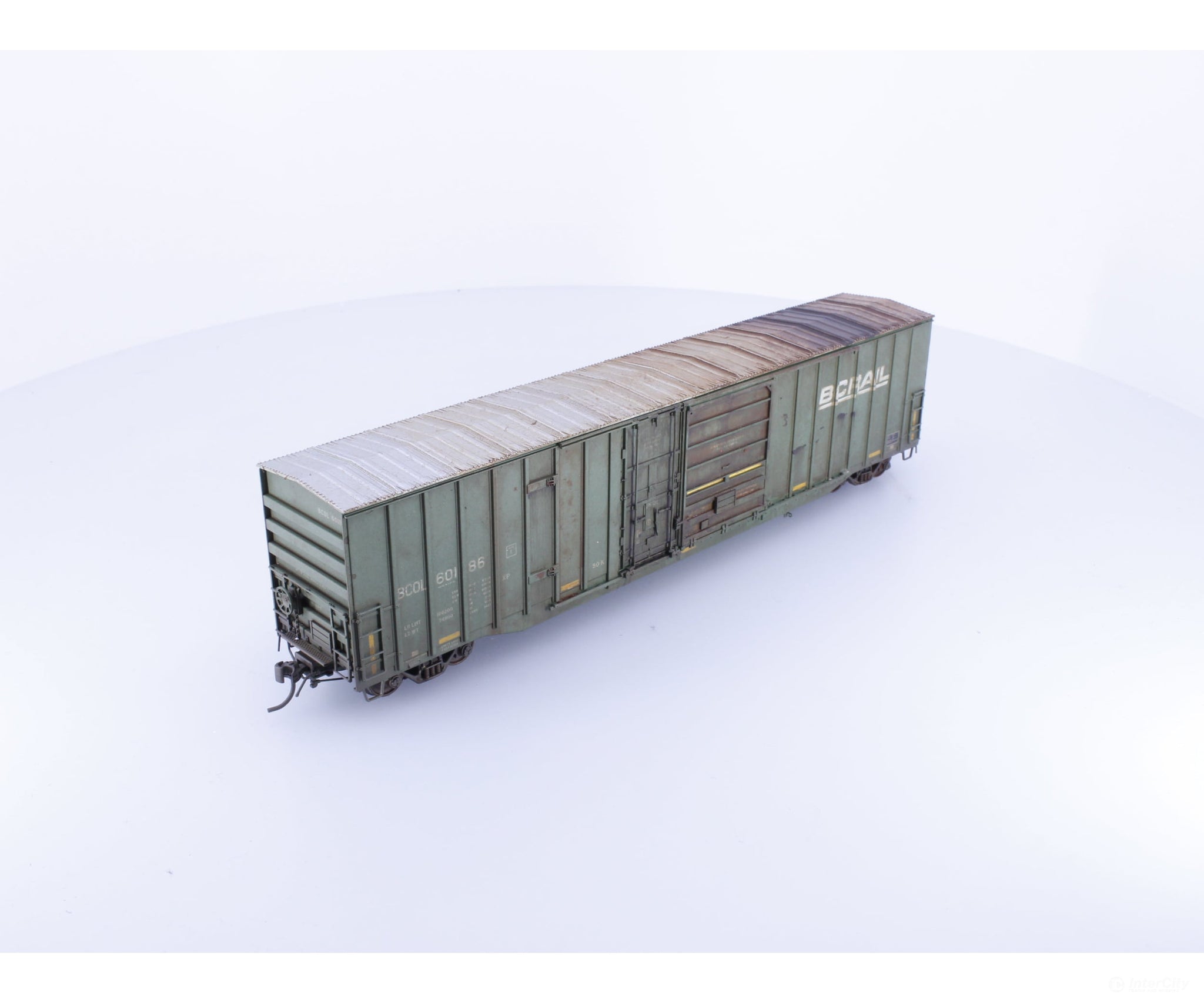 Rapido 191004A-WMT-XH HO Trenton Works 6637cuft boxcar: BC Rail - faded w/conspicuity stripes faded #2 - Weathered by